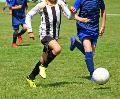 Kids are playing soccer